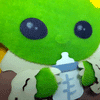 A close up of Grogu drinking from a bottle, made using flock.
