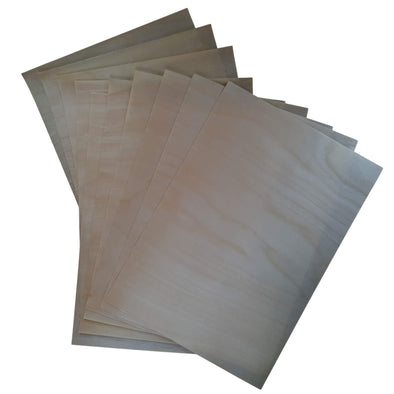 A4 Self adhesive real wood veneer sheets laid out on a white surface