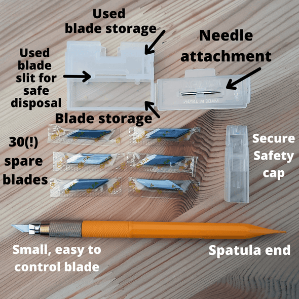 Olfa AK5 craft knife, replacement blades and storage, all placed out for easy viewing