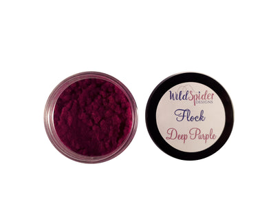A pot of Deep Purple flocking powder, open with the lid next to it