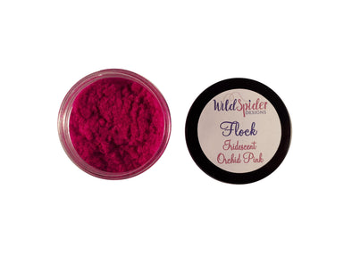 Iridescent Orchid Pink Flocking powder for crafts in an open pot next to the flock lid.