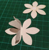 Die cut flowers covered in Sticky Roll with part of the liner pulled up