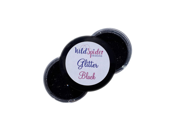pots of ultra fine black glitter for crafts open with the lid on top