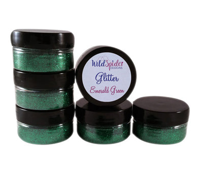 Emerald Green ultra fine glitter for crafts, stacked up on one another.