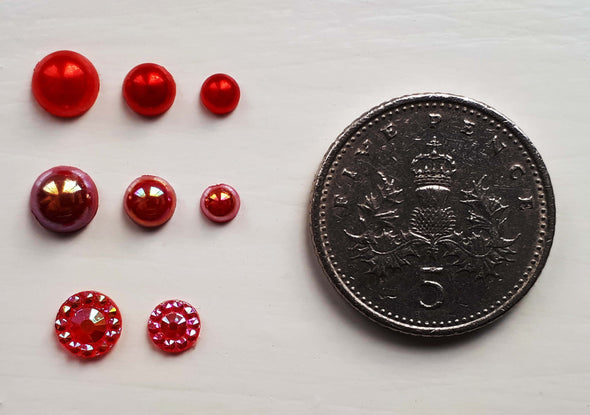 Flat back pearls next to a 5 pence piece to show sizes