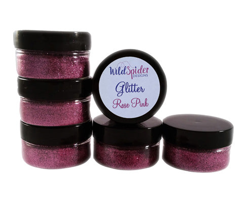 Ultra Fine Rose Pink Glitter, in pots, stacked on each other.