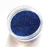 Royal Blue ultra fine glitter for crafts in an open pot.